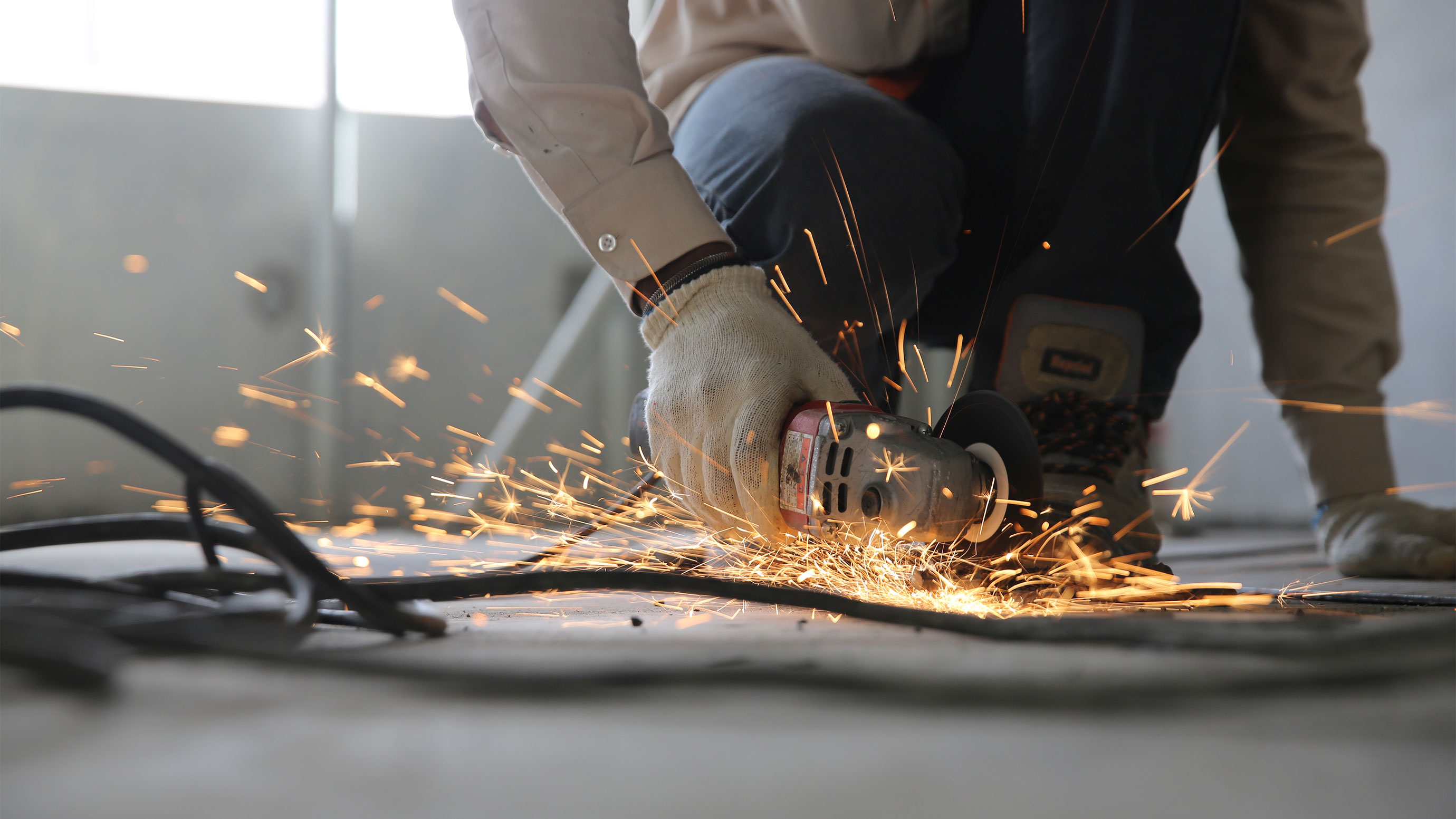 Man with rotary saw